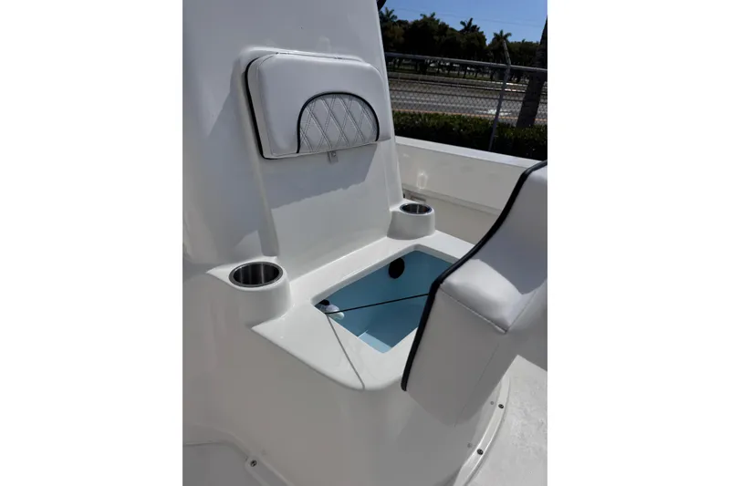 Slide: The Image of Interior of 2026 Sundance B20CCR boat with seating and cup holders. - 2
