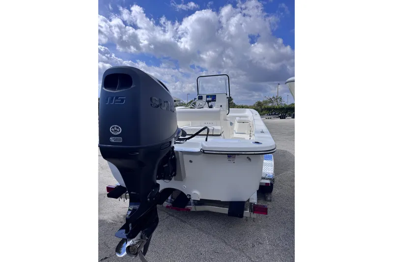 Slide: The Image of 2026 Sundance B20CCR boat with powerful outboard motor under a cloudy sky. - 8