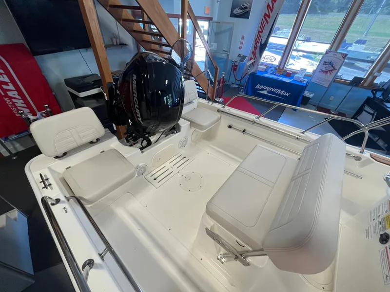 Slide: The Image of Interior view of a Boston Whaler 170 Montauk with seating and an outboard motor. - 5