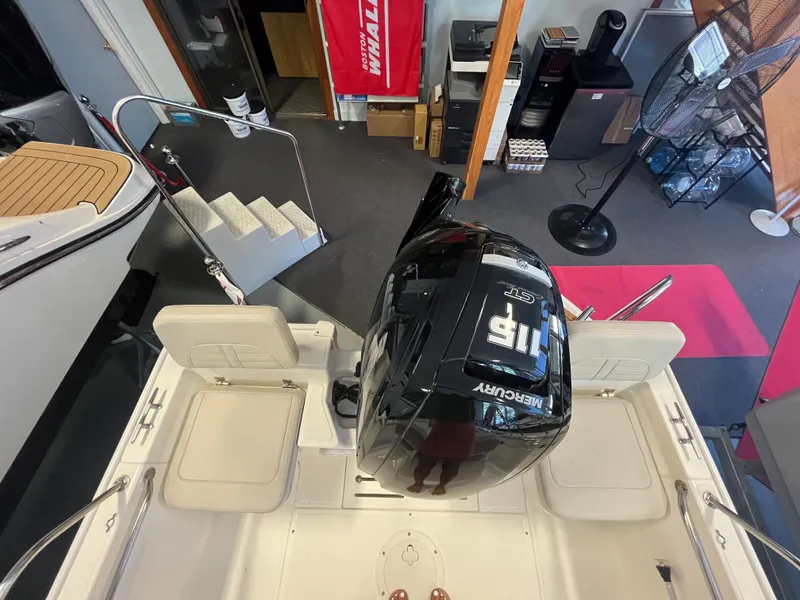 Slide: The Image of Interior view of a Boston Whaler 170 Montauk with a Mercury engine. - 1