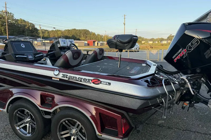 Slide: The Image of 2018 Ranger Z520L bass boat with Mercury Pro XS engine, parked outdoors. - 4