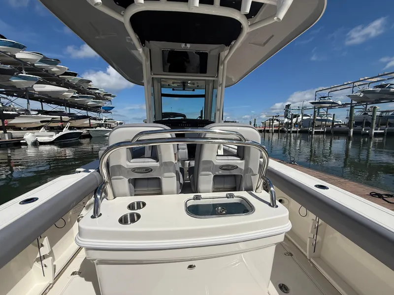 Slide: The Image of The image shows the cockpit of a 2027 Boston Whaler 250 Outrage, featuring modern seating and controls. - 20
