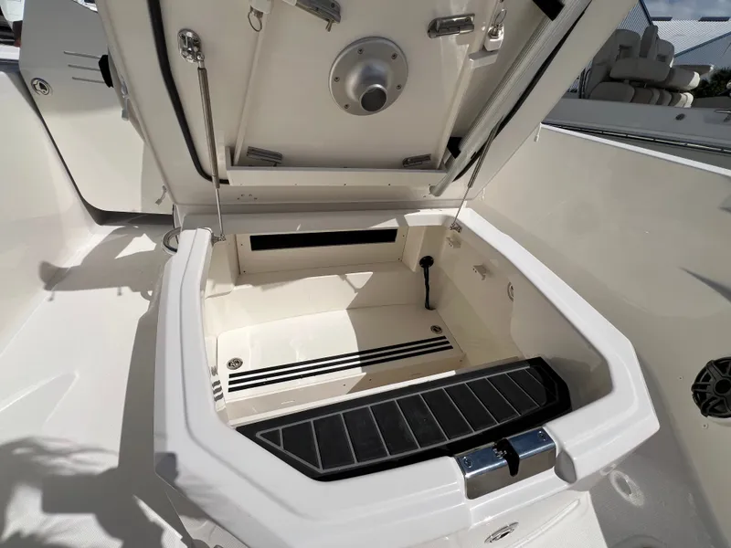 Slide: The Image of Open storage compartment in the boat with a sturdy lid and ventilation slots. - 31