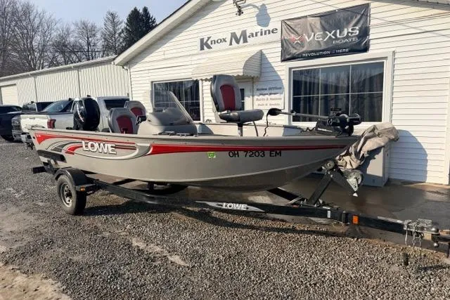 Slide: The Image of 2009 Lowe Fishing Machine 165 boat on trailer outside Knox Marine dealership. - 2