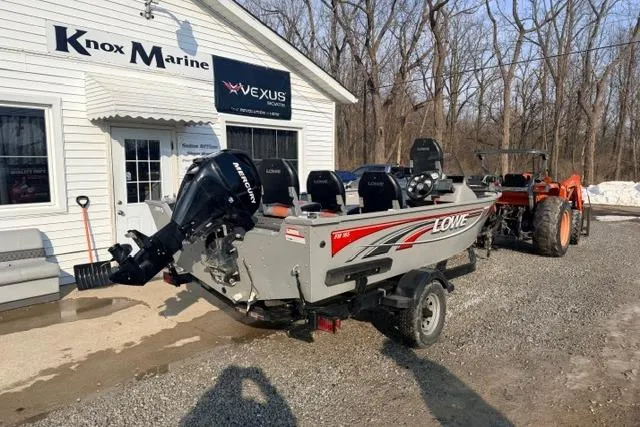 Slide: The Image of 2009 Lowe Fishing Machine 165 boat outside Knox Marine dealership. - 3