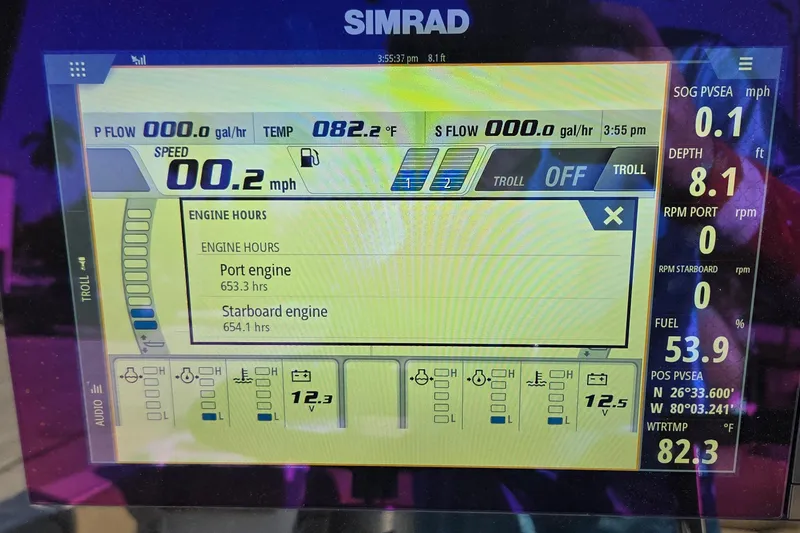Slide: The Image of Simrad display on 2018 Sportsman Open 252 Center Console showing engine hours and speed. - 13