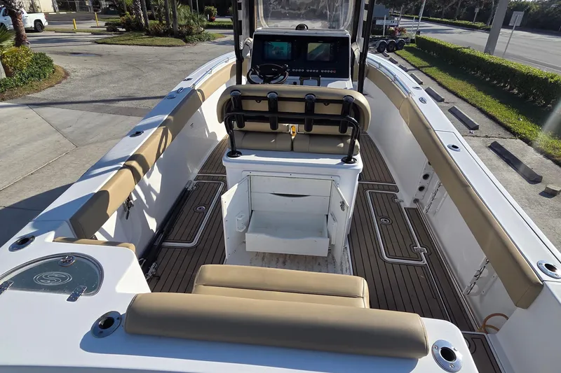 Slide: The Image of 2018 Sportsman Open 252 Center Console boat interior with seating and control panel. - 15