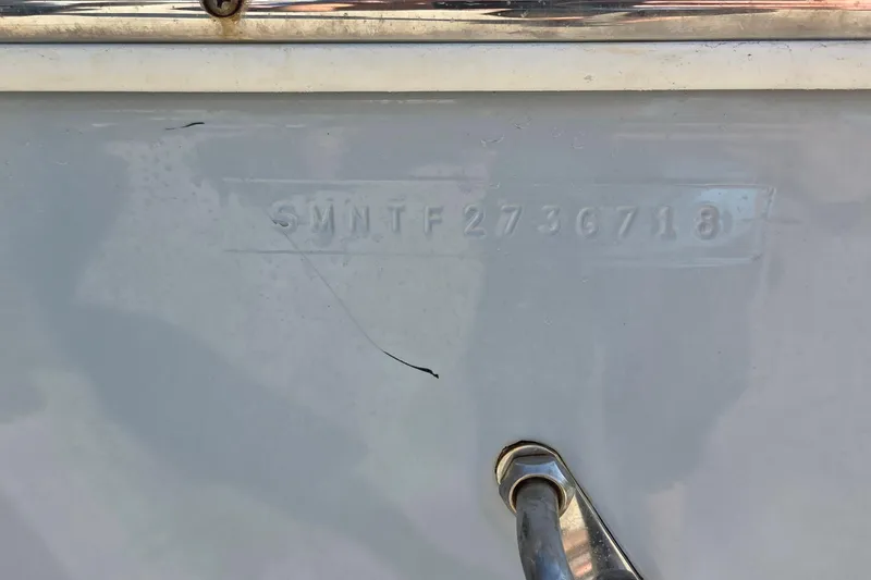 Slide: The Image of 2018 Sportsman Open 252 Center Console hull identification number (HIN) on boat exterior. - 17