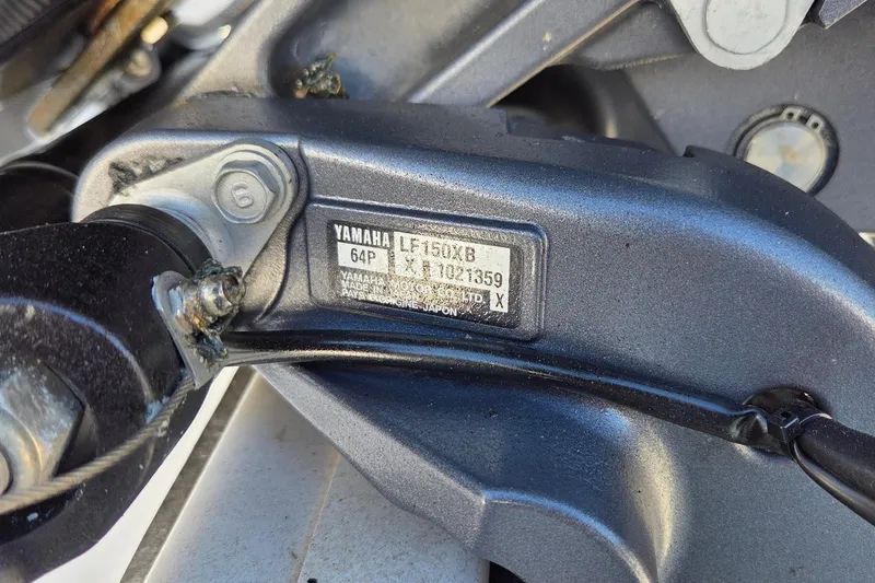 Slide: The Image of Close-up of Yamaha engine part on 2018 Sportsman Open 252 Center Console boat. - 19