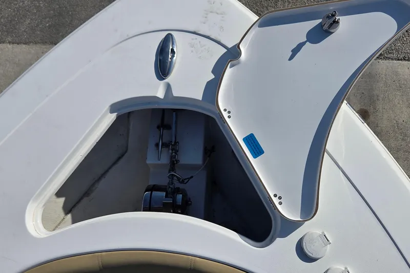 Slide: The Image of Open anchor compartment on 2018 Sportsman Open 252 Center Console boat. - 8