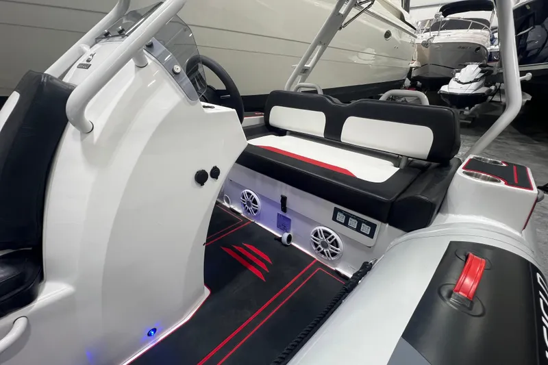 Slide: The Image of 2025 Highfield Velox 420 boat interior with sleek seating and modern controls. - 13