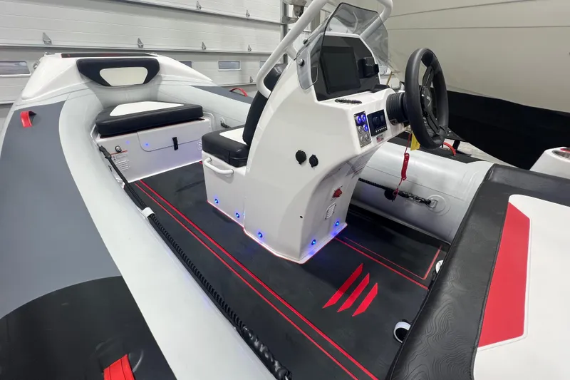 Slide: The Image of 2025 Highfield Velox 420 boat interior with modern dashboard and seating. - 14