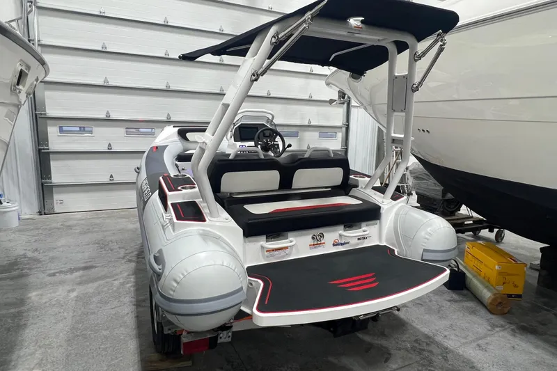 Slide: The Image of 2025 Highfield Velox 420 boat in a garage, showcasing sleek design and modern features. - 3