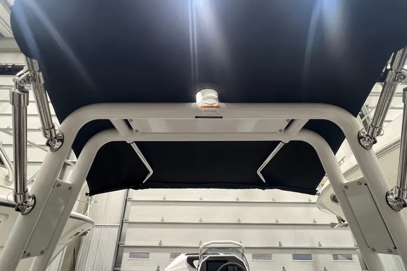 Slide: The Image of 2025 Highfield Velox 420 boat canopy and frame in a garage setting. - 7