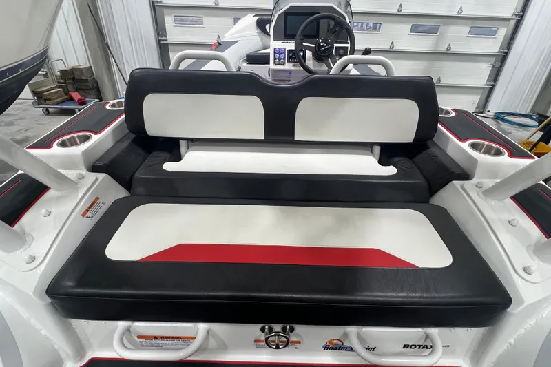 Slide: The Image of 2025 Highfield Velox 420 boat interior with black and white seating, red accents, and control panel. - 8