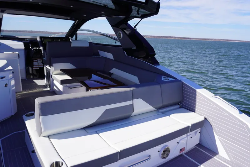 Slide: The Image of 2023 Cruisers Yachts 42 GLS OB luxury boat interior with seating and ocean view. - 10