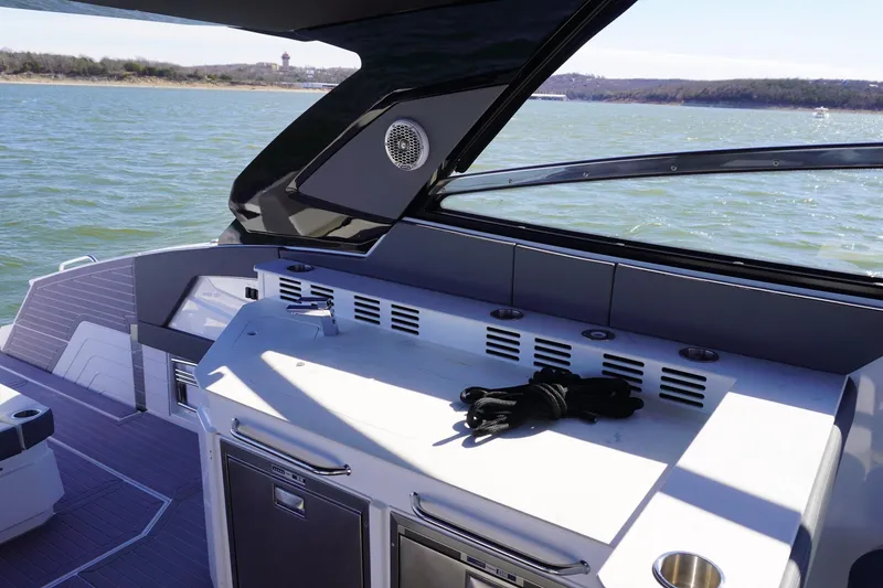 Slide: The Image of 2023 Cruisers Yachts 42 GLS OB interior with sleek design and water view. - 13