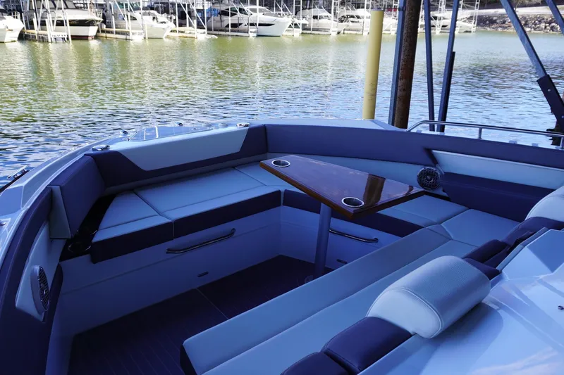 Slide: The Image of Luxurious seating area on 2023 Cruisers Yachts 42 GLS OB, docked by the marina. - 17