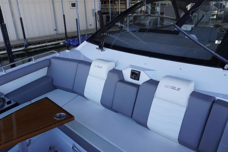 Slide: The Image of 2023 Cruisers Yachts 42 GLS OB interior with sleek seating and modern design. - 18
