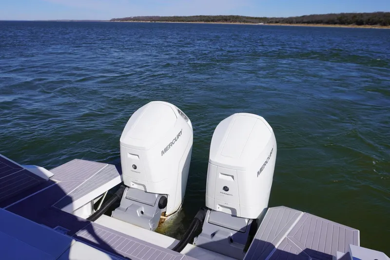 Slide: The Image of 2023 Cruisers Yachts 42 GLS OB with dual Mercury outboard engines on open water. - 9