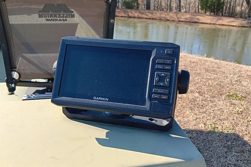 Slide: The Image of Garmin device on 2022 Lowe L1648M Jon boat near a pond. - 14