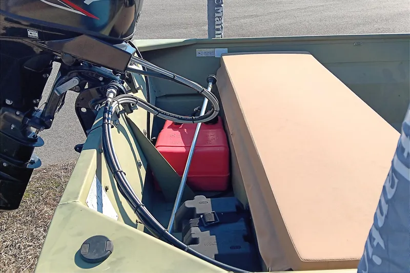 Slide: The Image of 2022 Lowe L1648M Jon boat interior with motor, fuel tank, and seating. - 15
