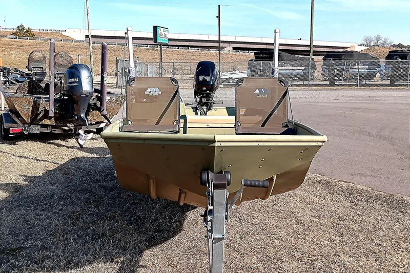 Slide: The Image of 2022 Lowe L1648M Jon boat on trailer, parked outdoors. - 4