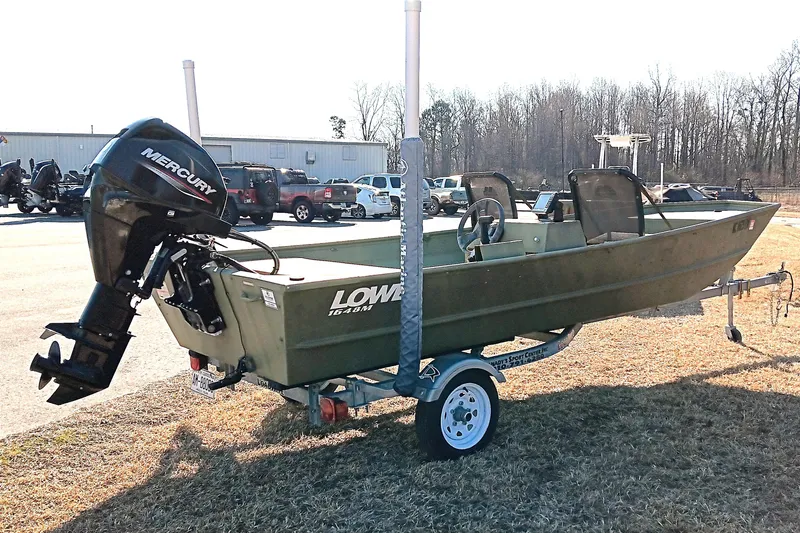 Slide: The Image of 2022 Lowe L1648M Jon boat with Mercury outboard motor on trailer. - 7