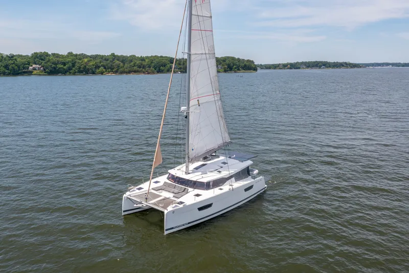Slide: The Image of Fountaine Pajot Astrea 42 Catamaran sailing on calm waters. - 10