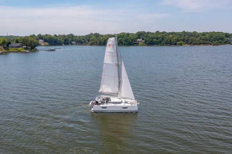 Slide: The Image of 2019 Fountaine Pajot Astrea 42 Catamaran sailing on calm waters. - 12