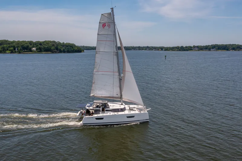 Slide: The Image of Fountaine Pajot Astrea 42 Catamaran sailing on calm waters, 2019 model. - 16