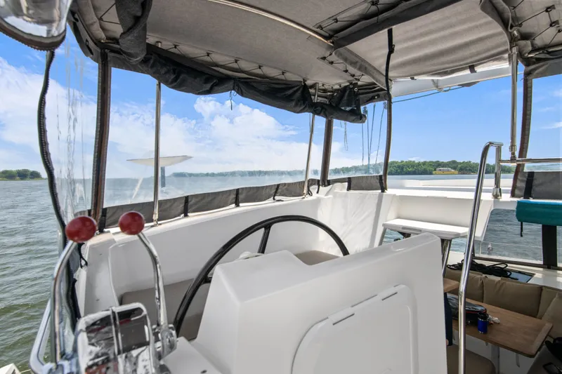 Slide: The Image of Cockpit of 2019 Fountaine Pajot Astrea 42 Catamaran on water. - 43