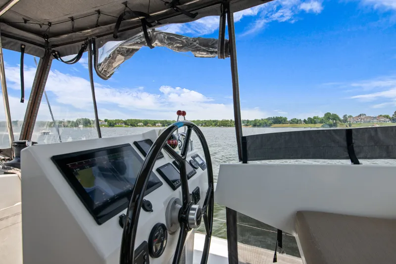 Slide: The Image of Helm of Fountaine Pajot Astrea 42 Catamaran on the water. - 45