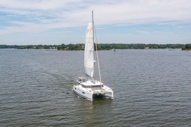 Slide: The Image of Fountaine Pajot Astrea 42 catamaran sailing on calm waters, 2019 model. - 5