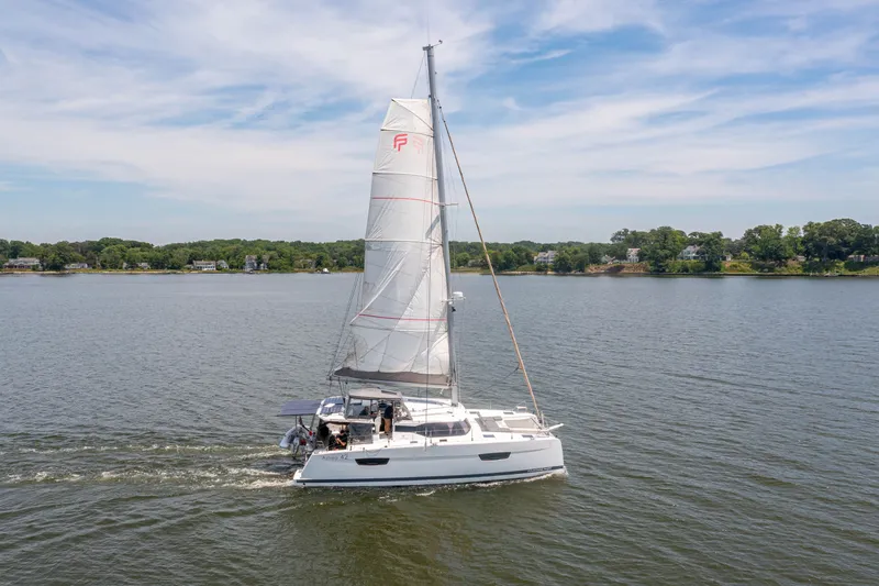 Slide: The Image of 2019 Fountaine Pajot Astrea 42 catamaran sailing on calm waters. - 7