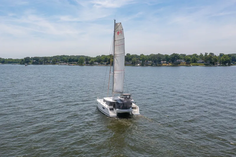 Slide: The Image of Fountaine Pajot Astrea 42 catamaran sailing on calm waters. - 9