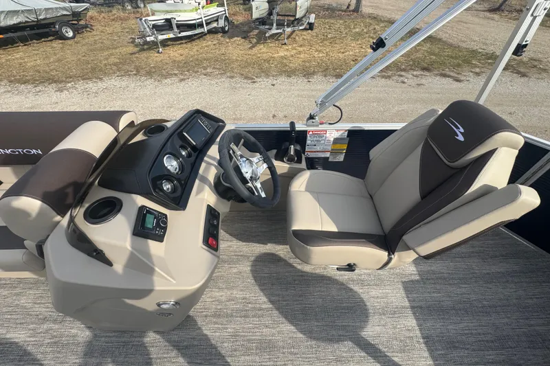 Slide: The Image of 2026 Bennington 20 SL boat interior with steering console and captain's chair. - 10