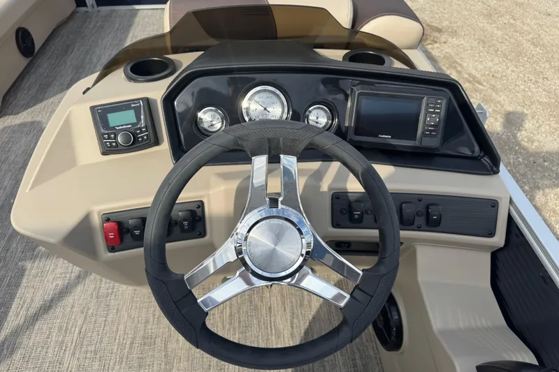 Slide: The Image of 2026 Bennington 20 SL boat dashboard with steering wheel and control panel. - 11