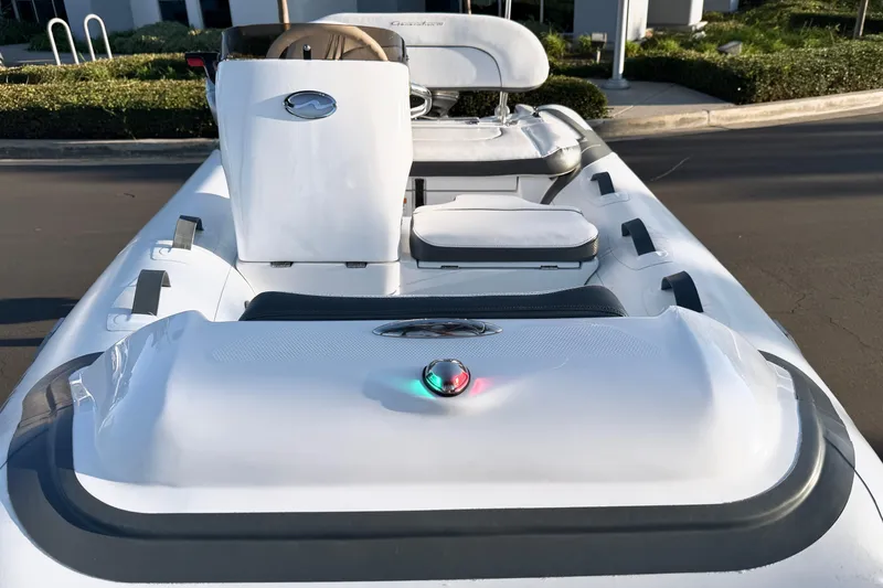 Slide: The Image of 2021 Walker Bay Generation 10 LTE boat, sleek design, white interior, modern controls. - 0