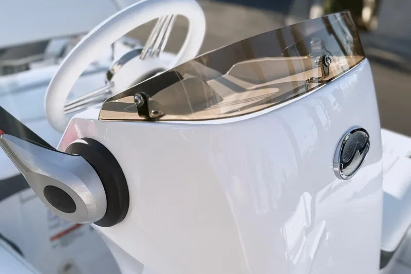 Slide: The Image of 2021 Walker Bay Generation 10 LTE boat console with sleek design and modern steering wheel. - 10