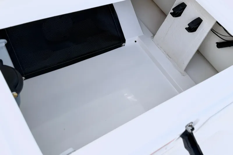 Slide: The Image of Storage compartment of 2021 Walker Bay Generation 10 LTE boat, featuring clean white interior. - 11