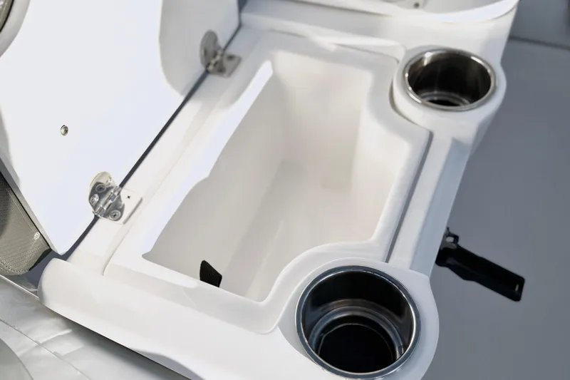 Slide: The Image of 2021 Walker Bay Generation 10 LTE boat interior with storage compartment and cup holders. - 13