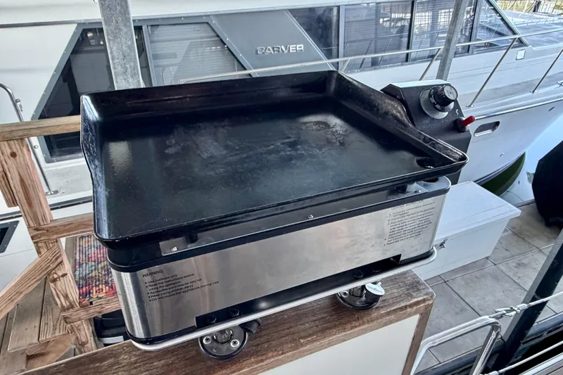 Slide: The Image of Outdoor griddle on dock near 1987 Carver 4207 Aft Cabin Motor Yacht. - 10