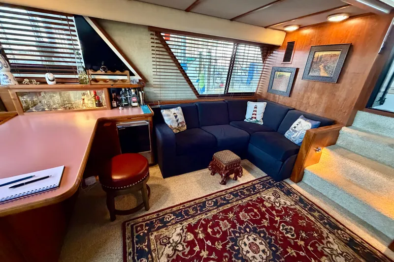 Slide: The Image of Cozy interior of 1987 Carver 4207 Aft Cabin Motor Yacht with bar and seating area. - 25