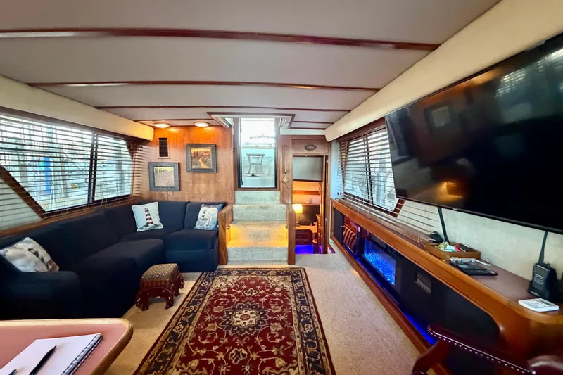 Slide: The Image of Luxurious interior of 1987 Carver 4207 Aft Cabin Motor Yacht with cozy seating and modern amenities. - 30