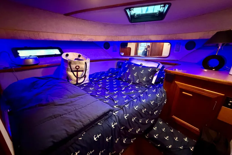 Slide: The Image of Cozy cabin interior of 1987 Carver 4207 Aft Cabin Motor Yacht with nautical-themed bedding. - 37