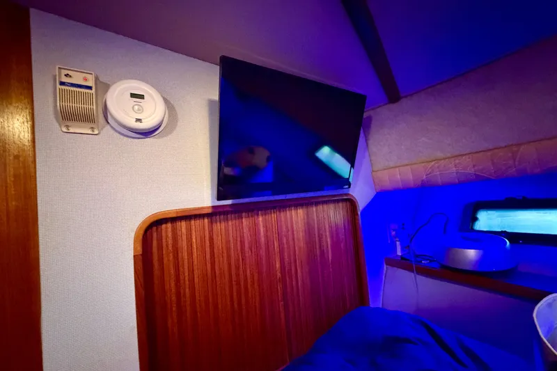 Slide: The Image of Interior of 1987 Carver 4207 Aft Cabin Motor Yacht with TV and smoke detector. - 38