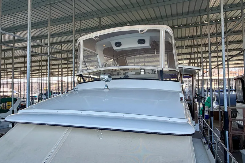 Slide: The Image of 1987 Carver 4207 Aft Cabin Motor Yacht docked in covered marina. - 8