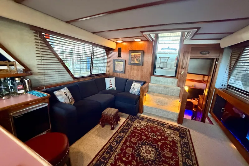Slide: The Image of Luxurious interior of 1987 Carver 4207 Aft Cabin Motor Yacht with cozy seating and elegant decor. - 31