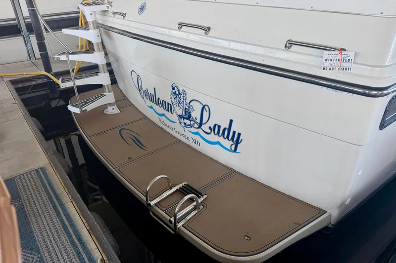 Slide: The Image of 1987 Carver 4207 Aft Cabin Motor Yacht docked, named "Cerulean Lady." - 4